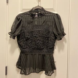 Sheer black blouse